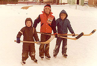 Image of Wayne as a young child in backyard rink.